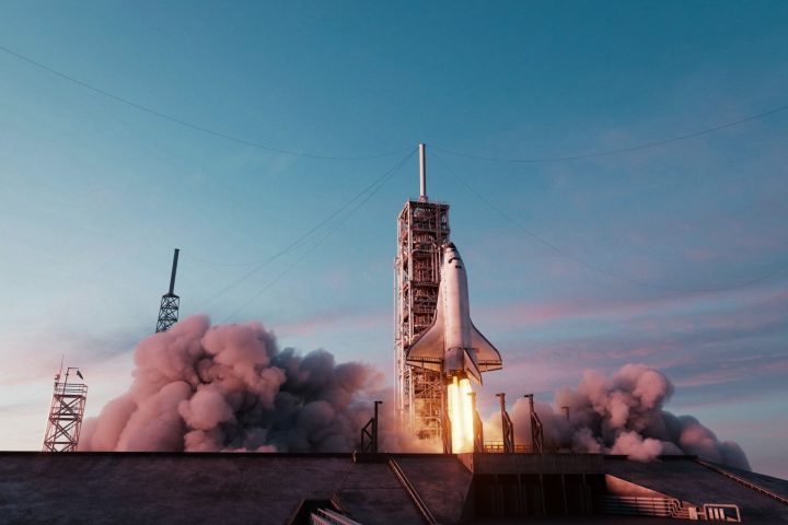 Rocket launch representing the Artemis program and its impact on aerospace and defense companies.